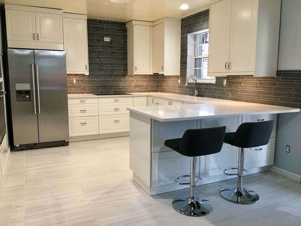Norstone Ash Grey Lynia Interlocking Tile used as a backsplash tile for a modern white and grey themed kitchen in Miami